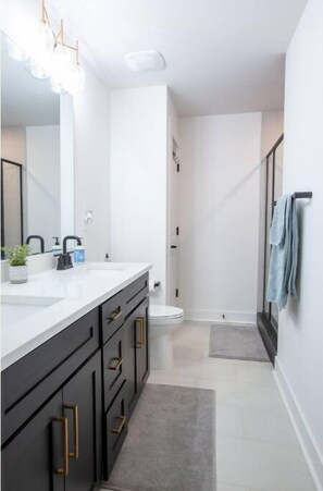 Shower, towels, soap, toilet paper