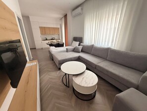 Family Room | Living area | 50-inch flat-screen TV with satellite channels - Regal Luxury Apartments (Sarande)