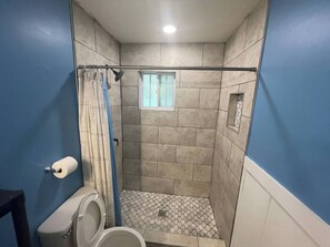 Shower, towels, soap, toilet paper