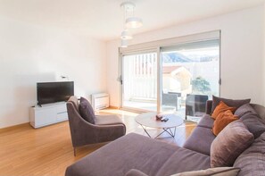 Appartement Deluxe, vue partielle sur la mer | Salle de séjour
