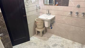 Shower, towels, soap, toilet paper