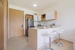 Standard Apartment | Private kitchen | Full-size fridge, microwave, oven, stovetop