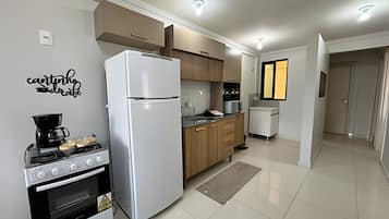 Basic Apartment | Private kitchen | Fridge, microwave, cookware/dishes/utensils, dining tables