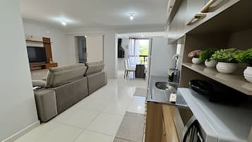 Basic Apartment | Private kitchen | Fridge, microwave, cookware/dishes/utensils, dining tables