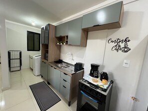 Apartment | Private kitchen | Fridge, microwave, cookware/dishes/utensils, dining tables