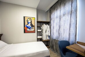 Family Triple Room, Balcony, City View | Desk, laptop workspace, free WiFi