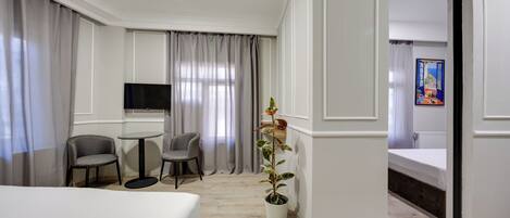 Family Suite, Balcony, City View | Desk, laptop workspace, free WiFi