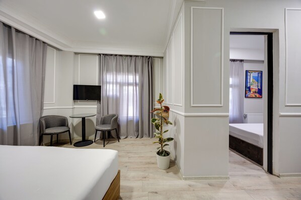 Family Suite, Balcony, City View | Desk, laptop workspace, free WiFi