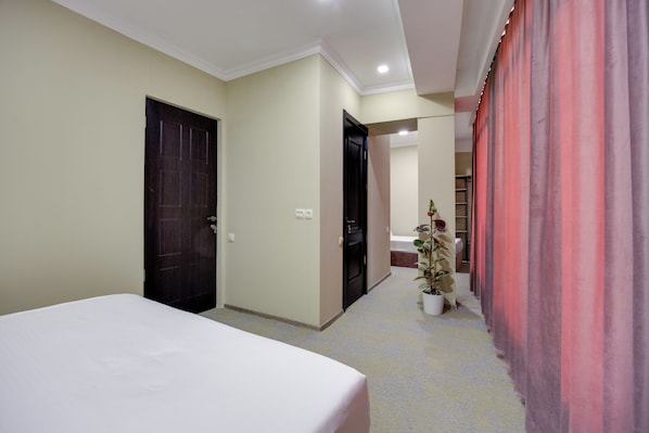Family Triple Room, Balcony, City View | Desk, laptop workspace, free WiFi