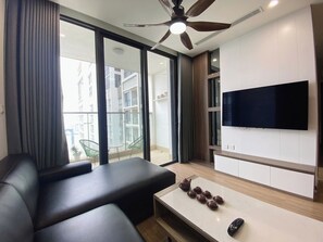 Executive Apartment, 3 Bedrooms, City View | Living area | 55-inch LED TV with cable channels