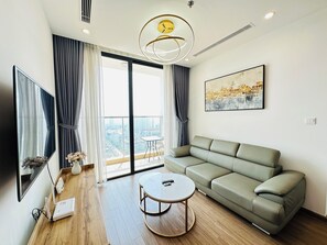 Luxury Apartment, 1 Queen Bed, City View | Living area | 55-inch LED TV with cable channels - Autopia Stay - Vinhomes Skylake (Hanoi)