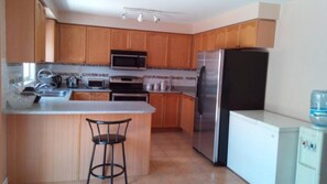 Fridge, microwave, oven, stovetop - Luxury Master Bedroom on Main Level of House (Brampton)