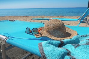 On the beach, sun-loungers - Elena's beach front apartment Gerakini (Kalyves Polygyrou)