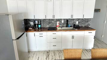 Fridge, microwave, stovetop, coffee/tea maker