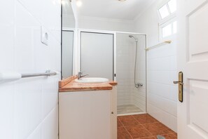 Shower, hair dryer, towels, toilet paper