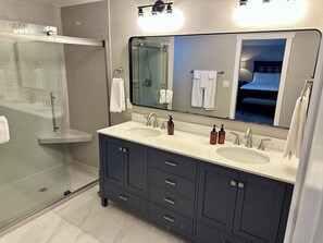 Shower, hair dryer, towels, soap
