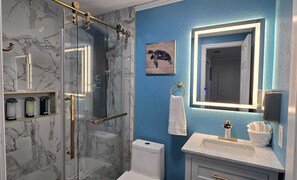 Shower, hair dryer, towels, soap
