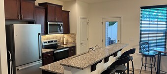 Charming 2-bedroom townhome that's fenced with private backyard.