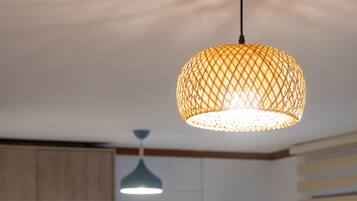 A hanging lamp with a woven, lattice design.
