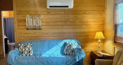 Charming cabin nestled in the woods in Andalusia, AL