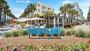 A hotel named GULERPLACE with outdoor seating and palm trees. - 30A SANTA ROSA BEACH RETREAT EASY 5 MIN WALK - 4BR 5BA HOUSE W/POOL (Santa Rosa Beach)