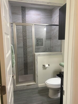 Shower, hair dryer, towels, soap