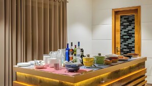 A buffet setup with various dishes and beverages. - amã Stays & Trails Kedar Villa, Mukteshwar (Mukteshwar)