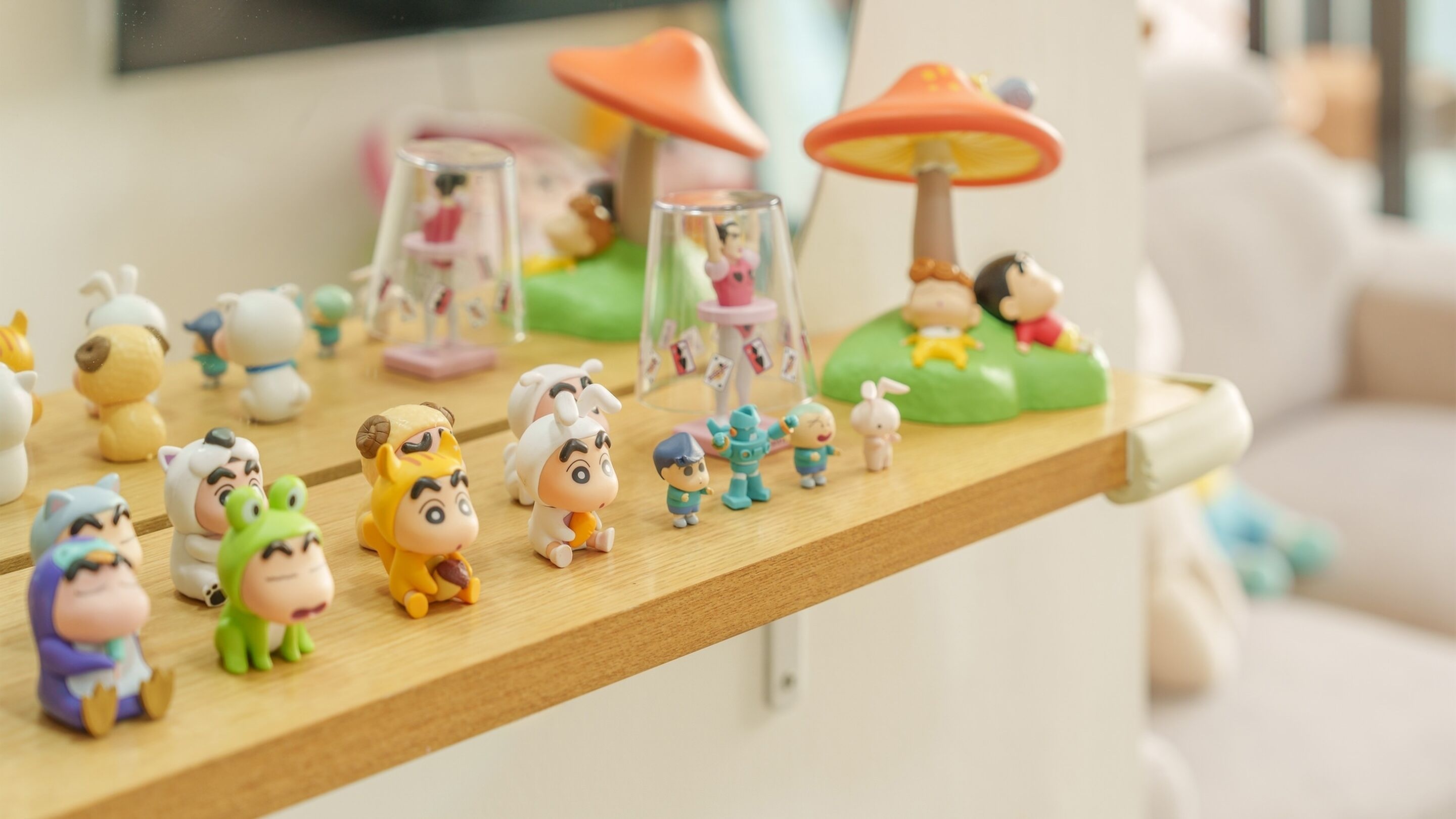 A shelf with various figurines and toys.