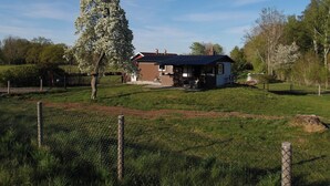 A house with a fenced yard, a tree, and a clear sky. - Live in a scenic location, close to hiking trails or cozy cafés (Västra Götalands län)