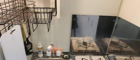 Fridge, microwave, stovetop, cookware/dishes/utensils