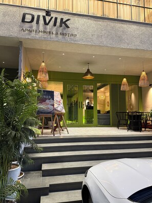 A building with a sign reading 'DIVIK APART HOTEL & BISTRO'. - Divik Aparthotel (Bhopal)
