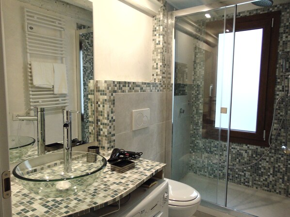 Shower, hair dryer, towels, soap