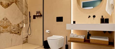 Shower, hair dryer, towels, shampoo
