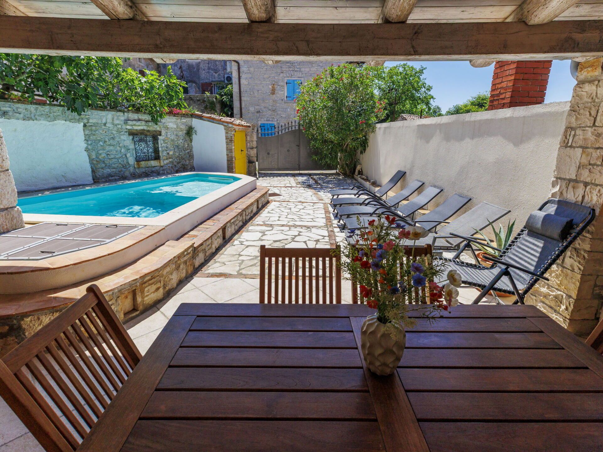 Furniture, Outdoor Furniture, Swimming Pool, Flooring, Floor, Chair, Composite Material, Resort, Outdoor Table, Patio