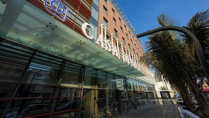A modern building with a large glass facade and a prominent sign reading "CASA DEB". - Casa Di Ora Hotel Al Rawdah (Jeddah)