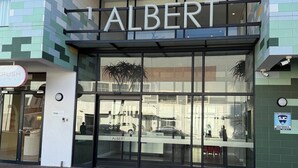 A modern building with the name 'ALBERT' prominently displayed above the entrance. - Chick and Luxurious Studio (Cape Town)