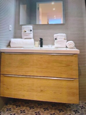 Hair dryer, towels, soap, toilet paper