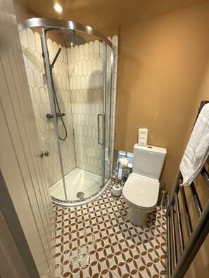 Shower, hair dryer, towels, soap