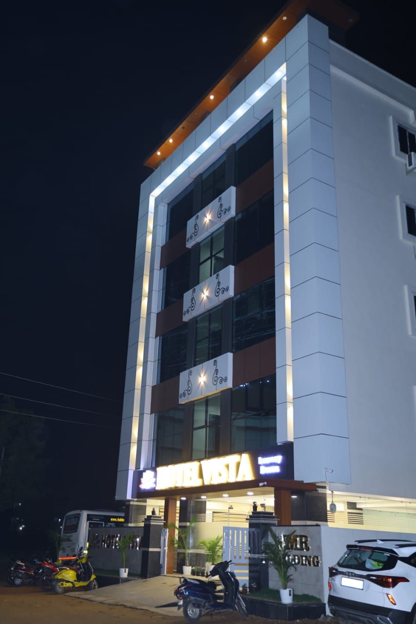 A multi-story building with a prominent sign reading "Hotel Vista."