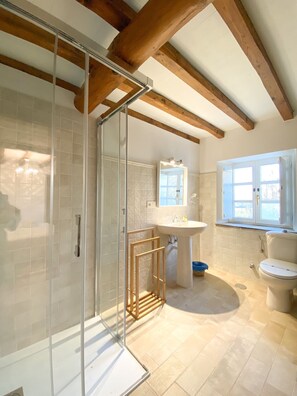 Shower, hair dryer, towels, soap