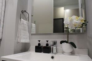 Shower, towels, soap, toilet paper