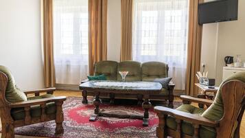 Superior Triple Room | Desk, laptop workspace, blackout drapes, iron/ironing board