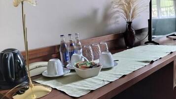 Desk, laptop workspace, blackout drapes, iron/ironing board