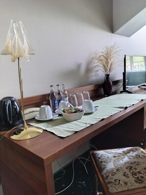 Desk, laptop workspace, blackout curtains, iron/ironing board