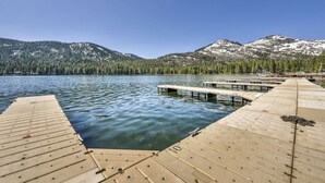 A wooden dock extending into a calm lake with snow-capped mountains in the background. - 243 Bldg C 1 Bedroom Condo (Truckee)
