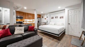 A compact living space with a kitchenette, a bed, a sofa, and a dining area. - 124 Bldg B Studio (Truckee)