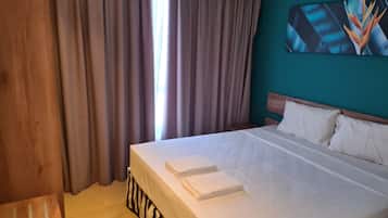 Apartamento familiar, balcón | Minibar, wifi gratis, ropa de cama
