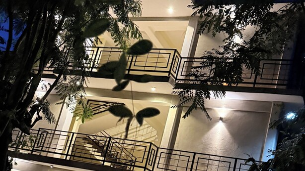 A multi-story building with a staircase leading to an upper level.
