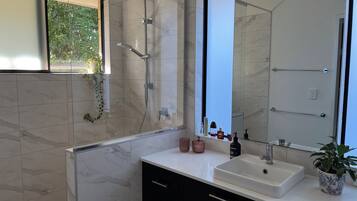 Shower, hair dryer, towels, soap