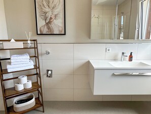 Shower, hair dryer, towels, soap